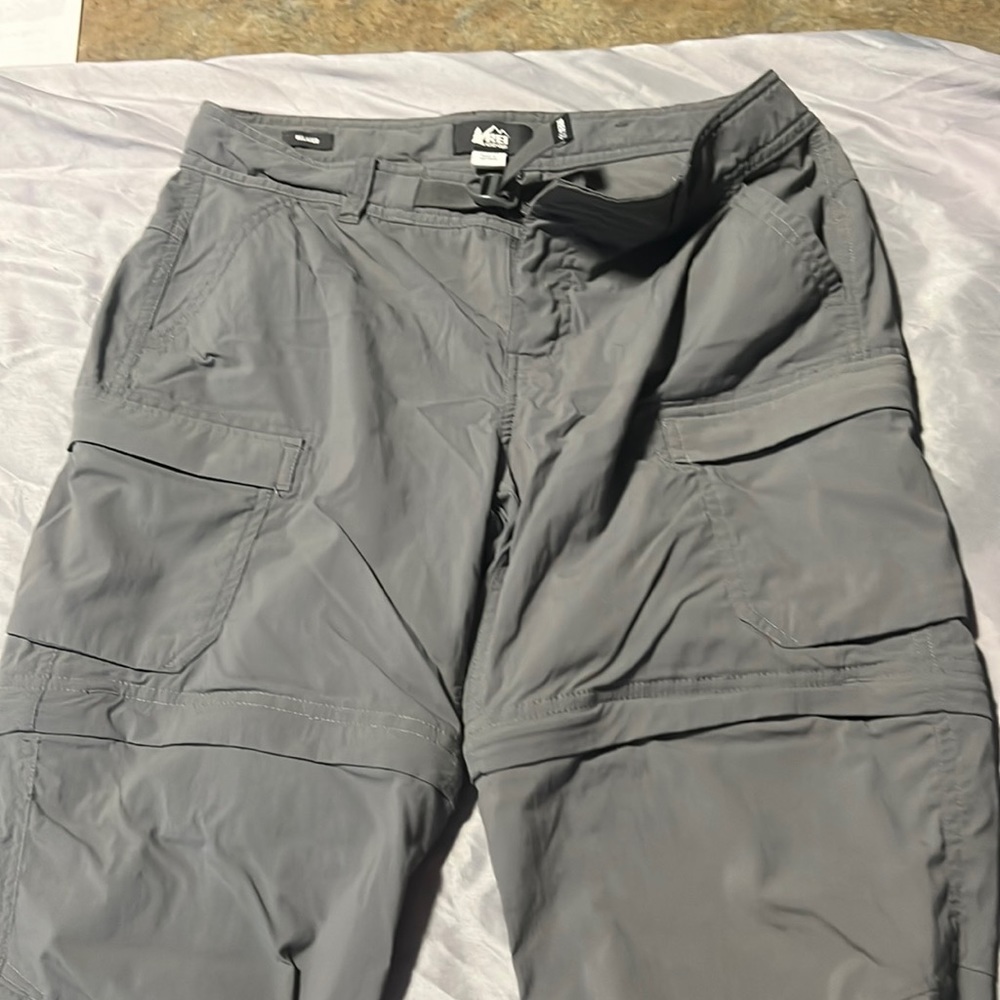 REI relaxed fit hiking pants with zipper to transition to shorts. Size 8 petite.
